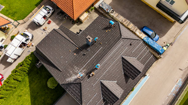 Roofing contractors working diligently on a residential roof in Douglasville, GA, showcasing teamwork and expertise in roof installation.