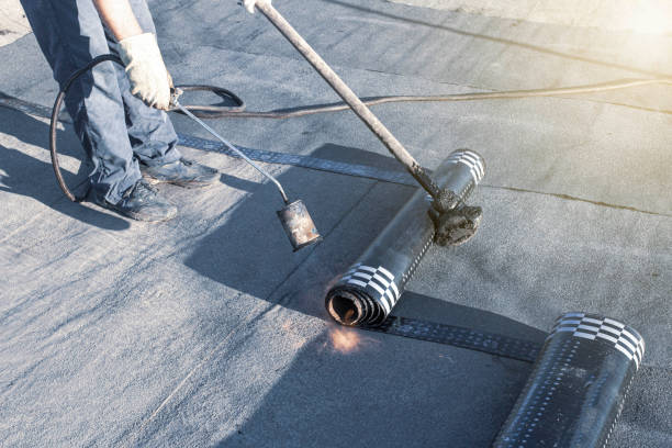 A large flat roof with an expansive view of the ocean, illustrating the setting for a flat roof replacement.
