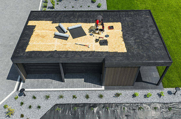 A flat roof with a panoramic ocean view, highlighting the area involved in a flat roof replacement process.