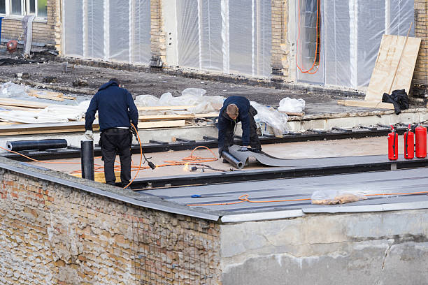 A large flat roof with an expansive view of the ocean, illustrating the setting for a flat roof replacement.